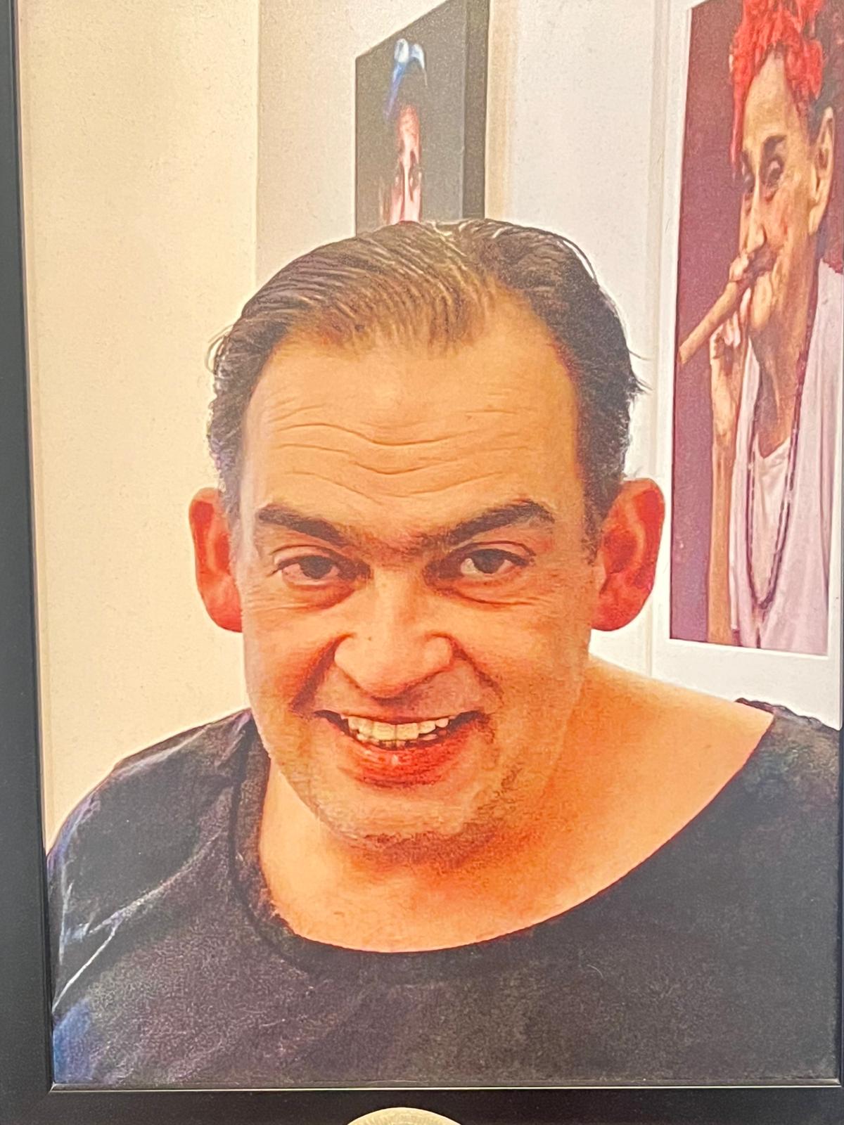 Porträt von Michel, dem verstorbenen Gründer von Alpha Eins Friseure
